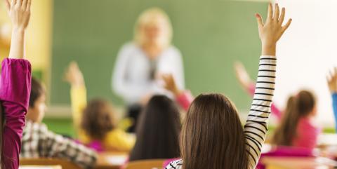 Students raising their hands