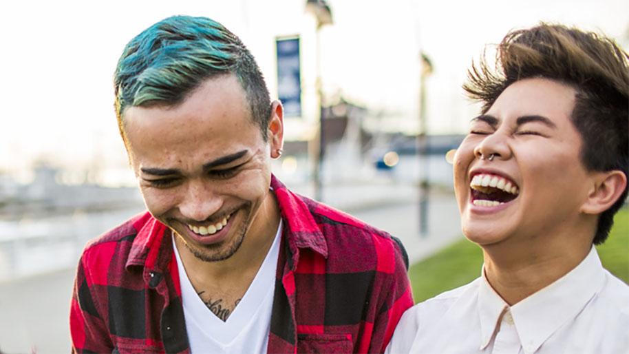 Two young people laughing