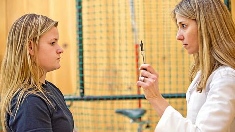 Doctor examining a patient for a concussion